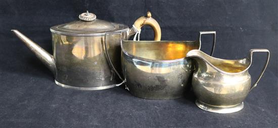 A Georgian matched three-piece silver teaset, oval-bodied with moulded edges, the teapot London 1829, William Southey, gross 31 oz.
